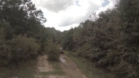 ATV Goes Through Puddle 01 Stock Footage 78070371