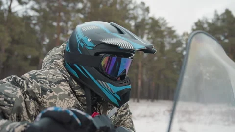 ATV helmet reflection. Hidden details before starting ATV journey in snow Stock Footage 346250787