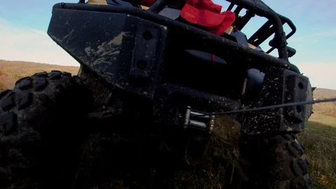 ATV helps another with the rope to get out of the mud Stock Footage 104011312