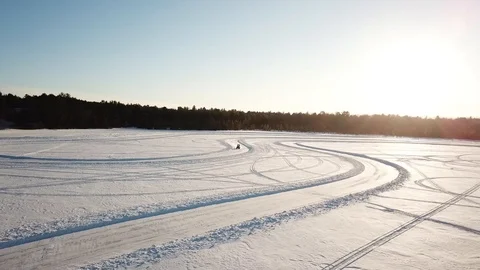 ATV on ice road Stock Footage 100135654