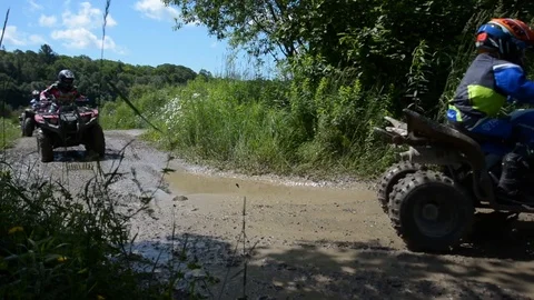 An ATV Makes a Splash in the Mud 스톡 동영상 88977578