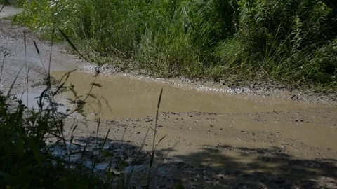An ATV Makes a Splash in the Mud 스톡 동영상 88977583