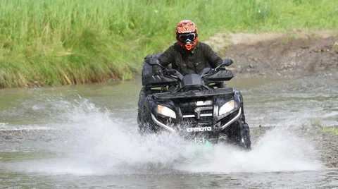 ATV on mountain river with splashes 스톡 동영상 40545208