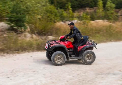 ATV overcomes the track Stock Photos