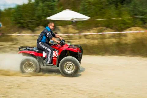 ATV overcomes the track Stock Photos