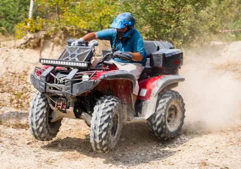 ATV overcomes the track Stock Photos