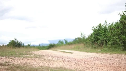 ATV passing by camera on the dirty road 動画素材 81671828