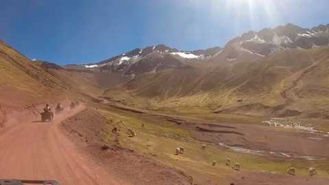 ATV quad bikes riding through the spectacular Andes mountains Stock Footage 344306575