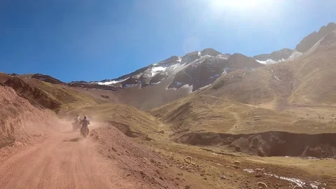 ATV quad bikes riding through the spectacular Andes mountains Stock Footage 344306607