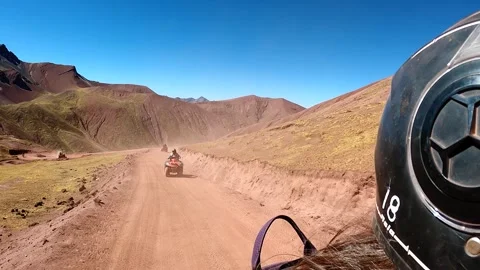 ATV quad bikes riding through the spectacular Andes mountains Stock Footage 344306626