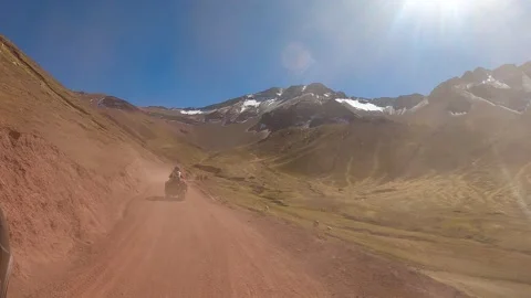ATV quad bikes riding through the spectacular Andes mountains Stock Footage 344306788