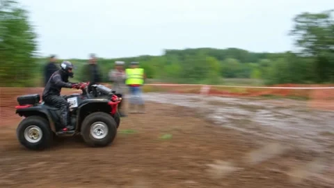 ATV race through a puddle Stock Footage 189037577