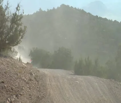 ATV with red flag and headlights passes camera Video stock 21634868