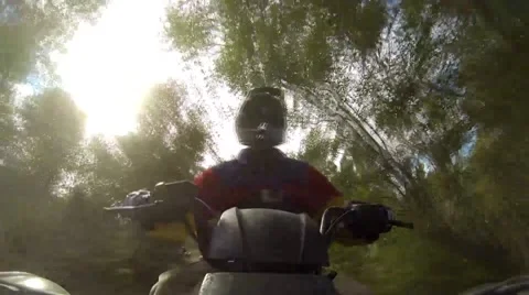 ATV Ride Through Trees 스톡 동영상 44490393