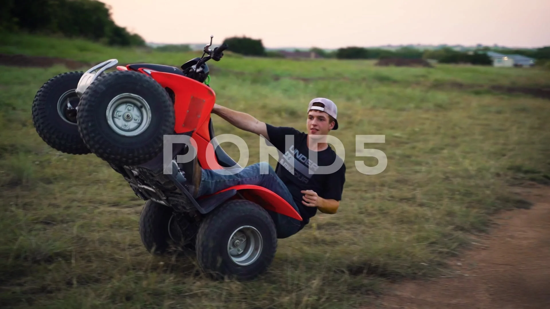 ATV Rider on Four Wheeler Popping a Stock Video Pond5