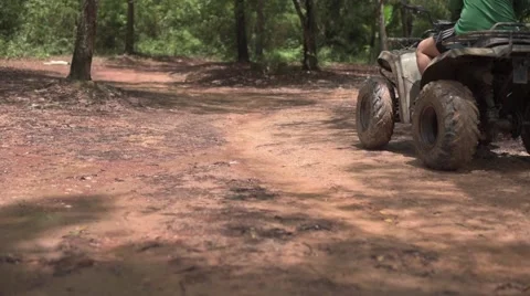 ATV riding in the forest Stock Footage 63886873