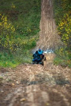 ATV riding on a forest track Stock Photos