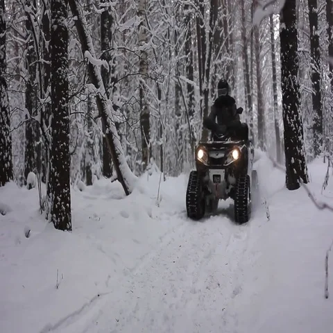ATV riding in the snow Stock Footage 69560477