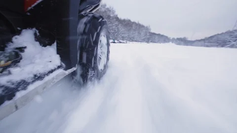 ATV riding in the snow Stock Footage 100994731