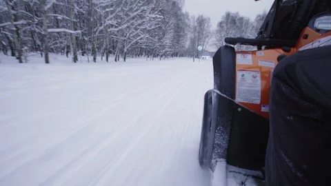 ATV riding in the snow Stock Footage 100994747