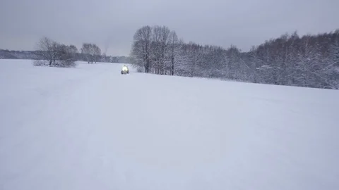 ATV riding in the snow Stock Footage 100994774