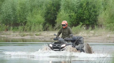 ATV in river Stock Footage 40544635