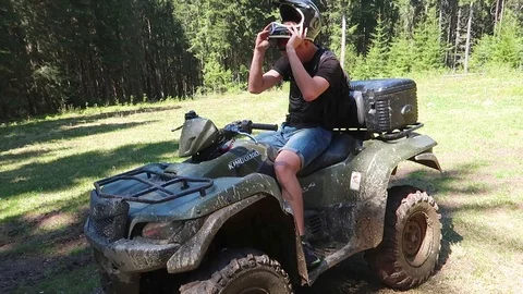ATV stands in the middle of a forest Vídeo Stock 89729547
