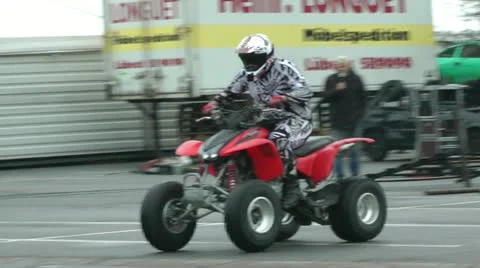 ATV at stunt show, back wheels drive, slow motion Stock Footage 11144546