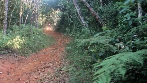 ATV with two people going down a trail Stock Footage 82869524