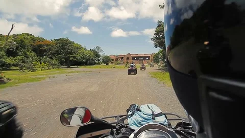 ATV's approaching a building Stock Footage 88226170