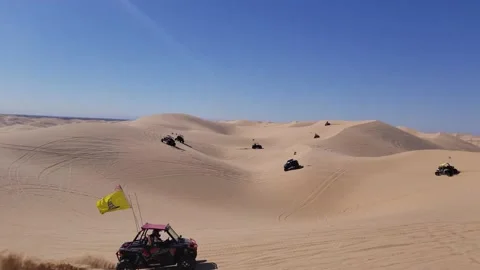 ATVs Driving in Formation on Sand Dune Desert, Sonoran, Yuma AZ Stock Footage 146552358