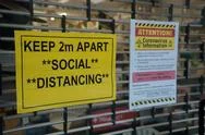 Auckland, New Zealand – 03/25/2020: Keep 2M Apart Covid-19 Sign In Shop Window Stock Photos