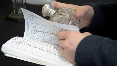 Auctioneer Checking Value Stock Footage 101341207