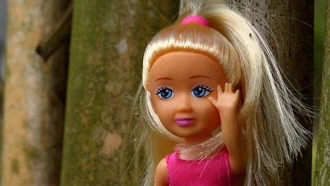 Audacious Doll on Green Bamboo Stock Footage 105202782