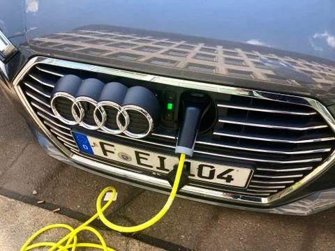 An Audi A3 e-tron plug-in hybrid car charging in the streets of Leipzig, Germany Stock Photos