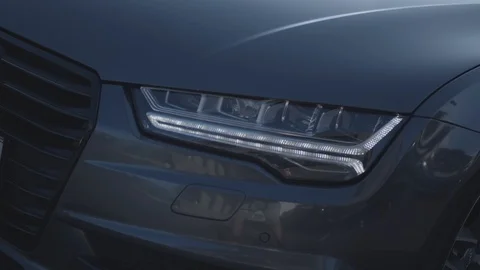 Audi A7 head lights. Audi A7 Frontscheinwerfer. Stock Footage 127003488