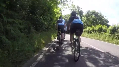 Audi driver nearly hits cyclists, forces oncoming cars to swerve. Admitted Stock Footage 272882646