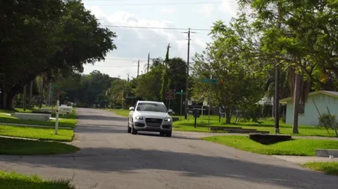 Audi Q7 car driving down neighborhood street Video stock 63320506