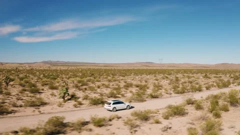 Audi Q7 driving through Mojave Desert Stock Footage 232462498