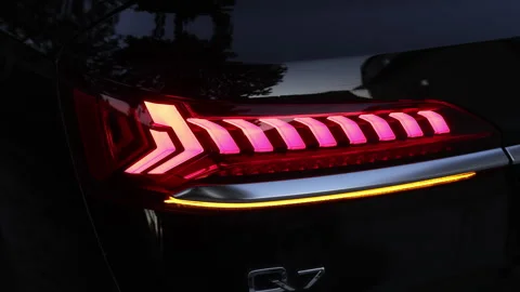 Audi Q7 Quattro 3.0 TFSI hybrid SUV. Rear LED lights closeup of electric SUV Stock Footage 335690053