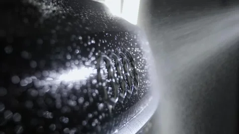Audi. A stream of water spray washes the emblem placed on the trunk. Stock-Footage 244084347