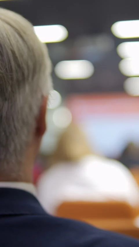 Audience attending a Conference from a Back View Perspective Engaged and Stock Footage 296729315
