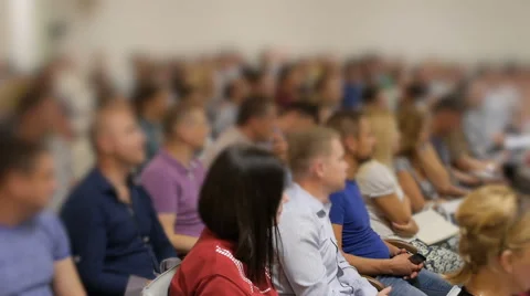 Audience blurred writing down at conference held for professional microstockers Stock Footage 67117635