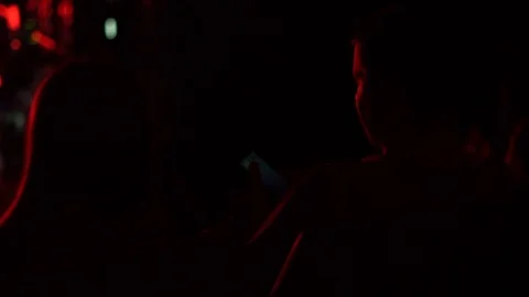 The audience at a concert sitting Stock Footage 94886929