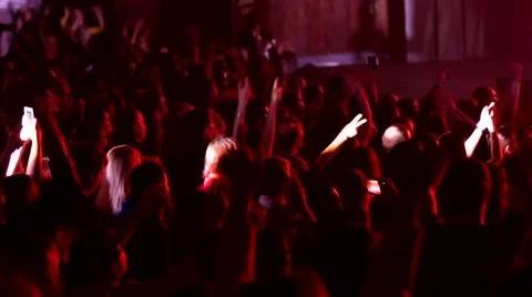 Audience crowd cheerfully applaud clapping hands in air at concert lumiere Stock Footage 49938226