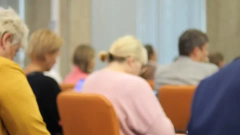 The audience engages in active discussion while keeping focused attention Stock Footage 288725759