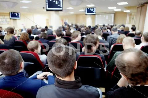 Audience listening to the speaker at conference in hall Stock Photos