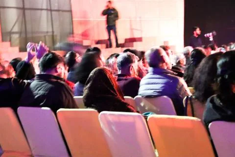 Audience looking at stage performance 库存照片