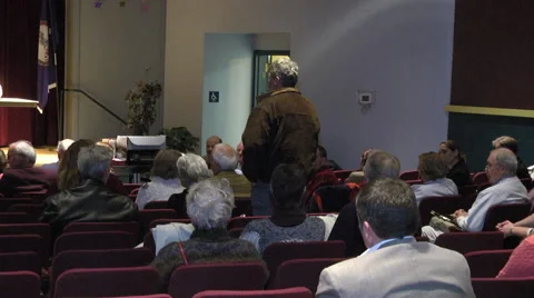 Audience member makes comments to panelists interior 動画素材 41636509