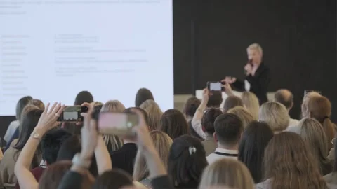 Audience recording speaker presentation at tech conference seminar with Stock Footage 336326303